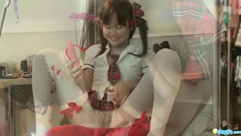Lusty Asian Bimbo plays with herself in a schoolgirl uniform