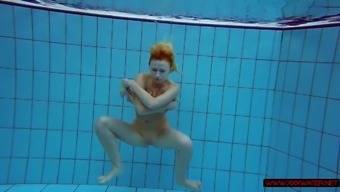 Blonde in a dress in a pool