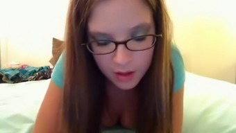 Pretty geek made to moan in front of her webcam viewers
