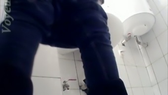 White chick in blue jeans filmed pissing in the toilet room