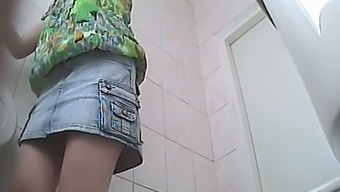 Chunky white stranger chick in denim skirt pisses in the toilet
