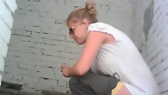 Blonde young white chick in sunglasses pisses on the floor in the toilet room