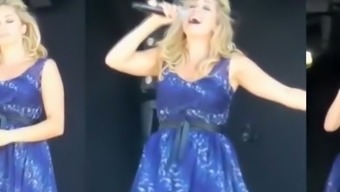 Wind lifts singer dress exposing her panties
