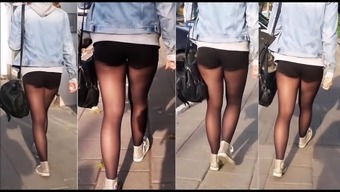 girl with nice legs in black pantyhose and shorts