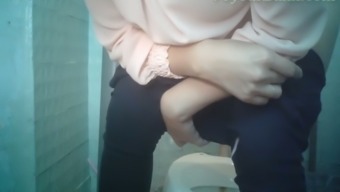Pale skin white girl in tight black pants pisses in the restroom