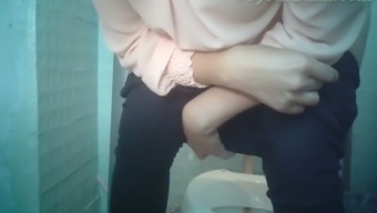 Pale skin white girl in tight black pants pisses in the restroom