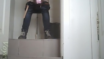 Brunette white chick in the public restroom pissing on hidden cam