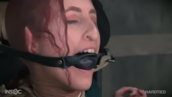 Bondage red haired whore Penny Lay gets her muff punished in the dark room