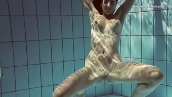 gorgeous sima swims naked in a pool exposing her beauty