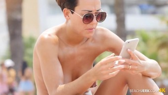 Pierced nipples spied on at the beach