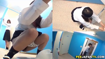 Schoolgirls from Japan filmed as they piss
