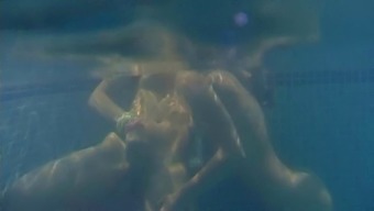 Alluring lesbian teen messing around in the swimming pool hardcore