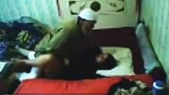 Voyeur tapes an arab hijab girl having missionary sex with a guy on the bed