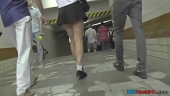 Upskirt footage of g-string of a girl in mini skirt