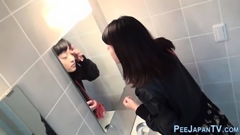 Asian babes filmed peeing