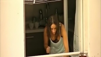 Voyeur films his hot neighbor in her kitchen