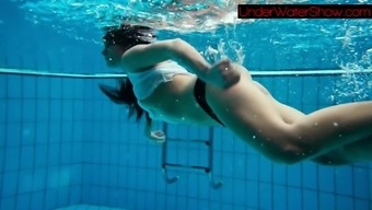 Perfect shaved teen in the pool