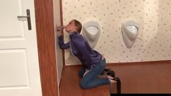 Classy girl sucks dick at toilet gloryhole