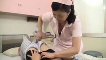 Aroused Japanese nurse having fun with a throbbing manhood