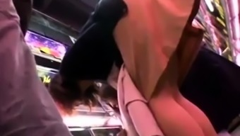 Pantyhosed Asian lady has a guy fingering her cunt in public 