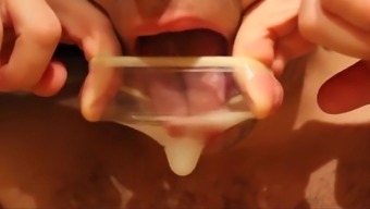 eating and playing with cum after fucking a melon and cumming into a condom