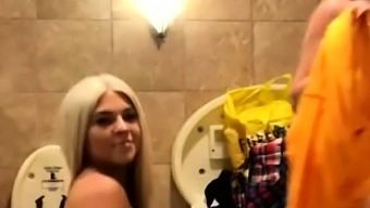 Two wild teens satisfy their lesbian lust in a public toilet