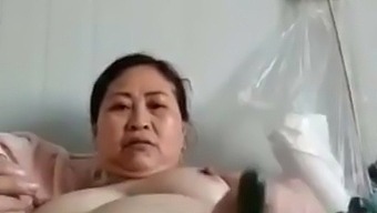 mature chubby Chinese woman with veggie
