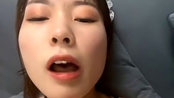Asian wife masturbates with sex toy and pees