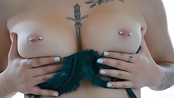 Busty brunette Bella bares her belly button piercing in seductive solo session