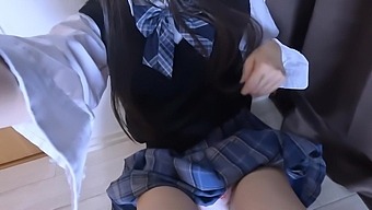 A Japanese coed masturbates alone in her dorm room